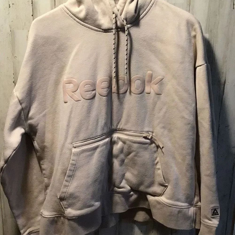 Hoodie from Reebok front zip pocket size youth large cream pinkish color